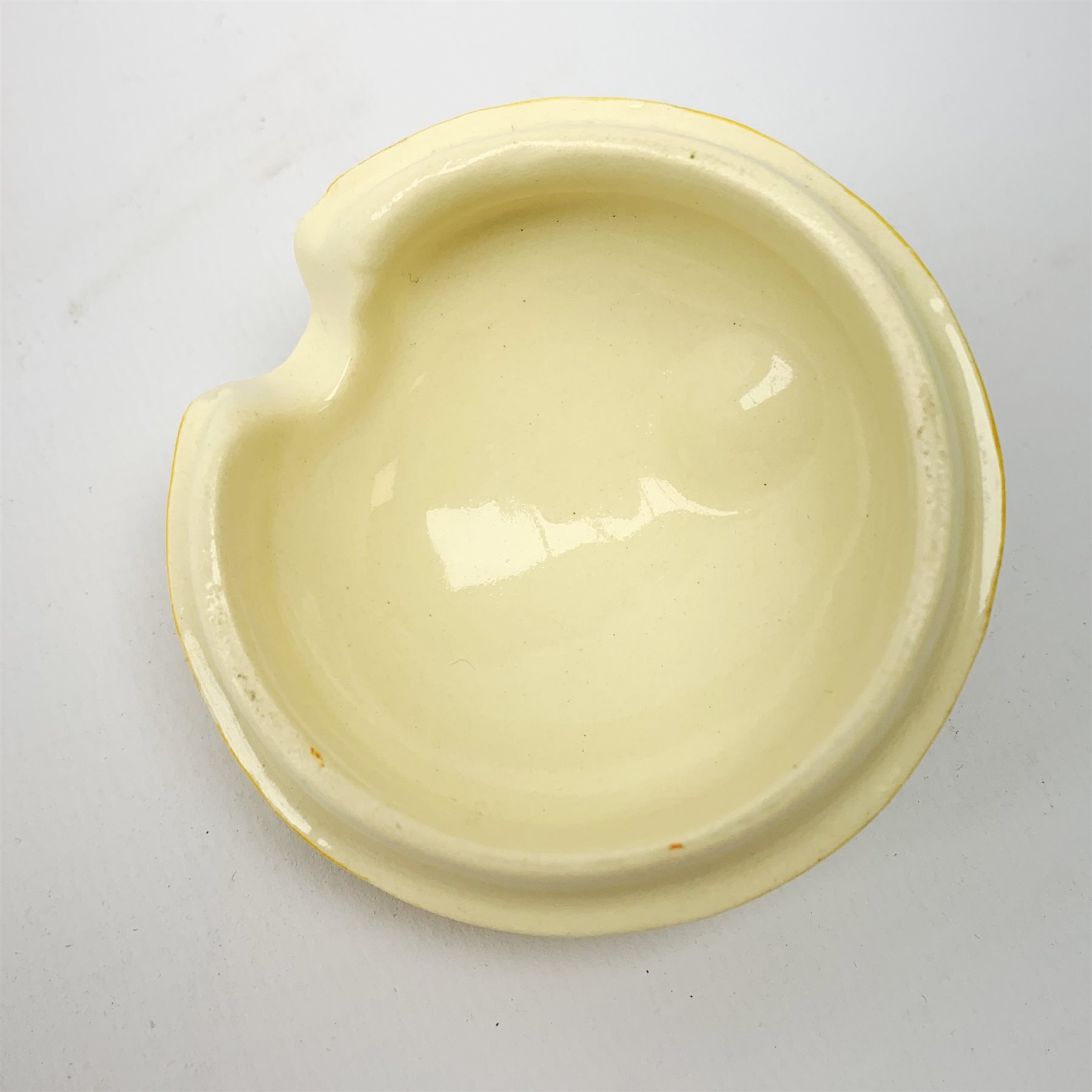 A Clarice Cliff Newport Pottery honey pot, modelled in the form of a beehive and decorated in the Crocus pattern, H10cm.