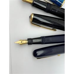 A group of four fountain pens, comprising Parker Duofold, nib marked 14K, Swan Mabbie Todd & Co Ltd Self Filler, nib marked 14C 585, Conway 57, nib marked 14ct, and Waterman Laureat. 