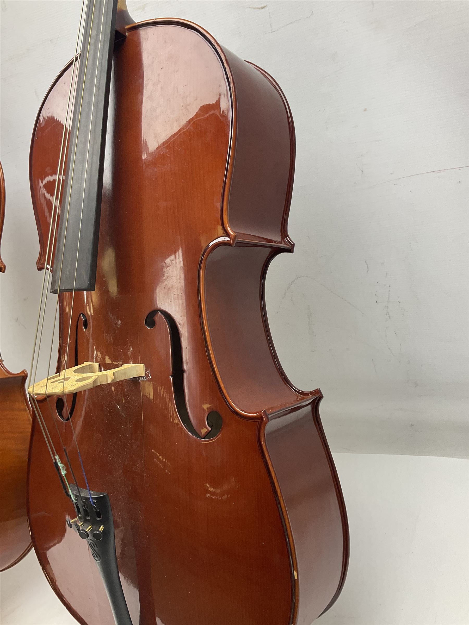 Modern Hungarian half-size cello with 69cm two-piece maple back and ribs and spruce top L114cm overall; and Stentor half size cello bearing label 'The Stentor Student II'; each in soft carrying case (2)