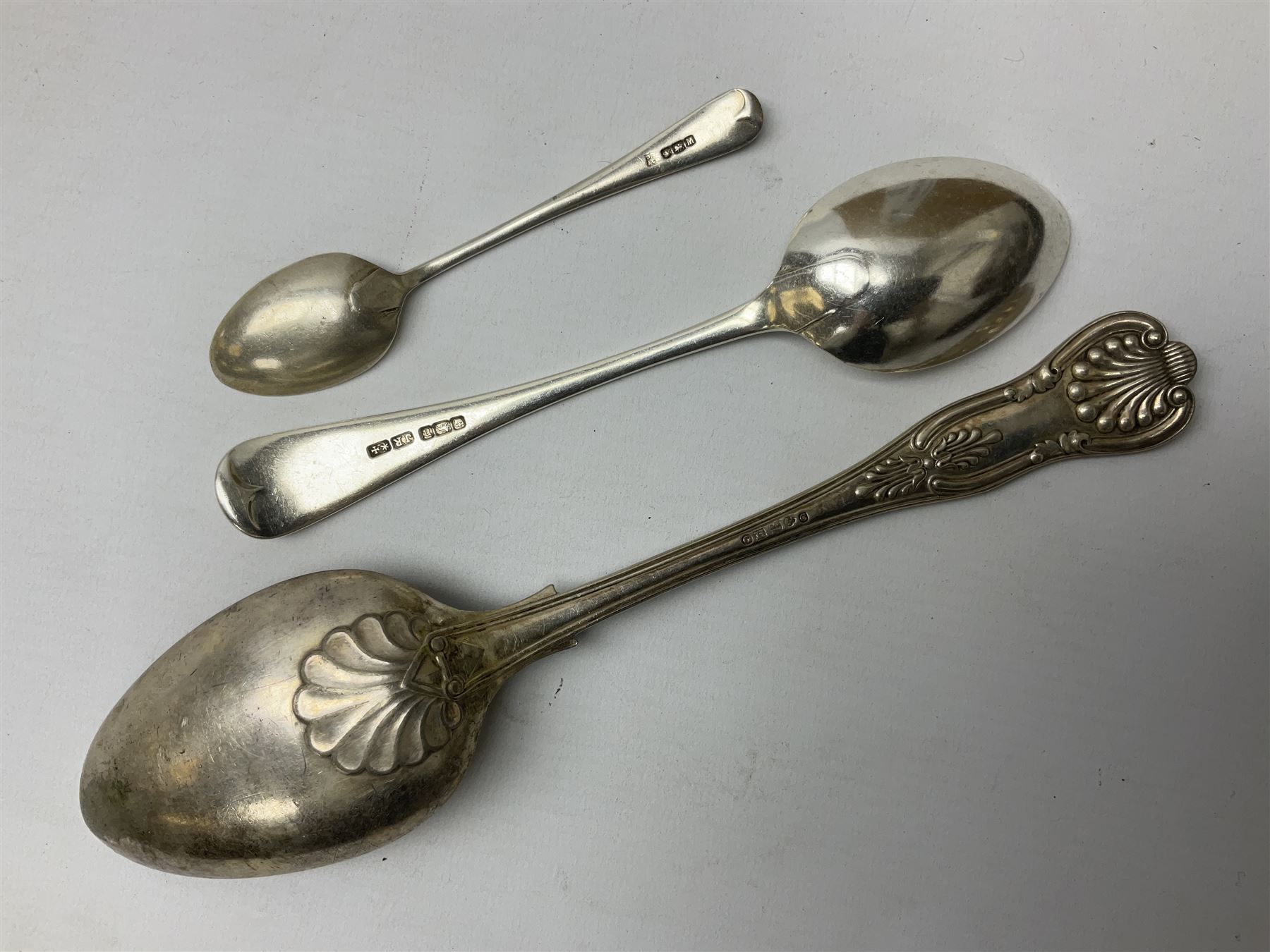 Edwardian silver dessert fork, and silver dessert spoon, hallmarked Sheffield 1905, and 1908, together with a mid 20th century coffee spoon, hallmarked Sheffield 1954, and a silver plated Kings pattern table spoon, approximate total silver weight 108 grams