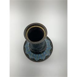 Japanese Cloisonné vase, the body of bulbus form with waisted neck,  upon spreading foot, with foliate decoration upon a black ground, H23cm. 