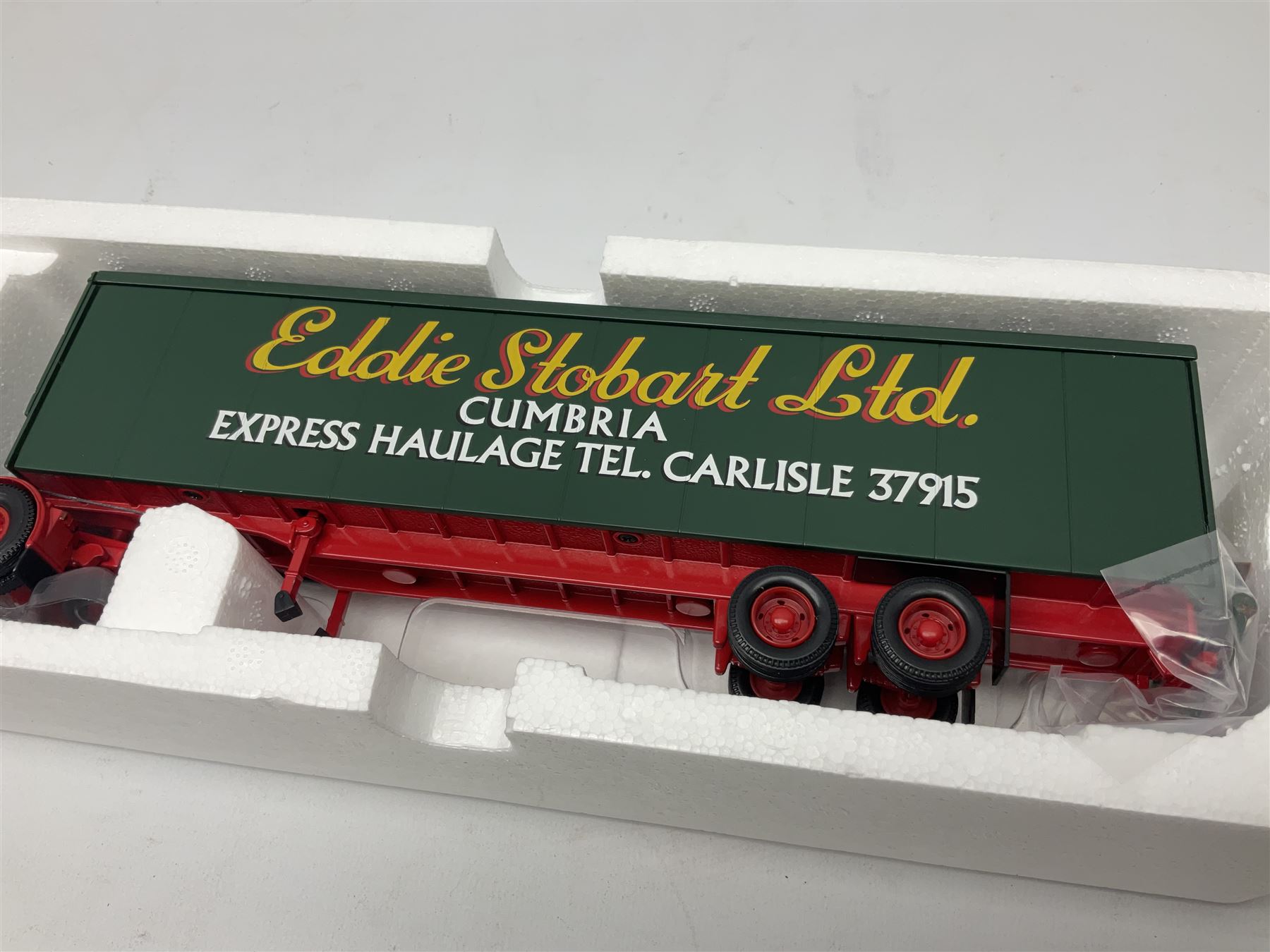 Corgi Eddie Stobart - three limited edition lorries; CC12901 Scania Topline Curtainside; CC13101 Volvo F88 Box Trailer; and CC13207 DAF XF Space Cab & Flatbed Trailer; all boxed (3)
