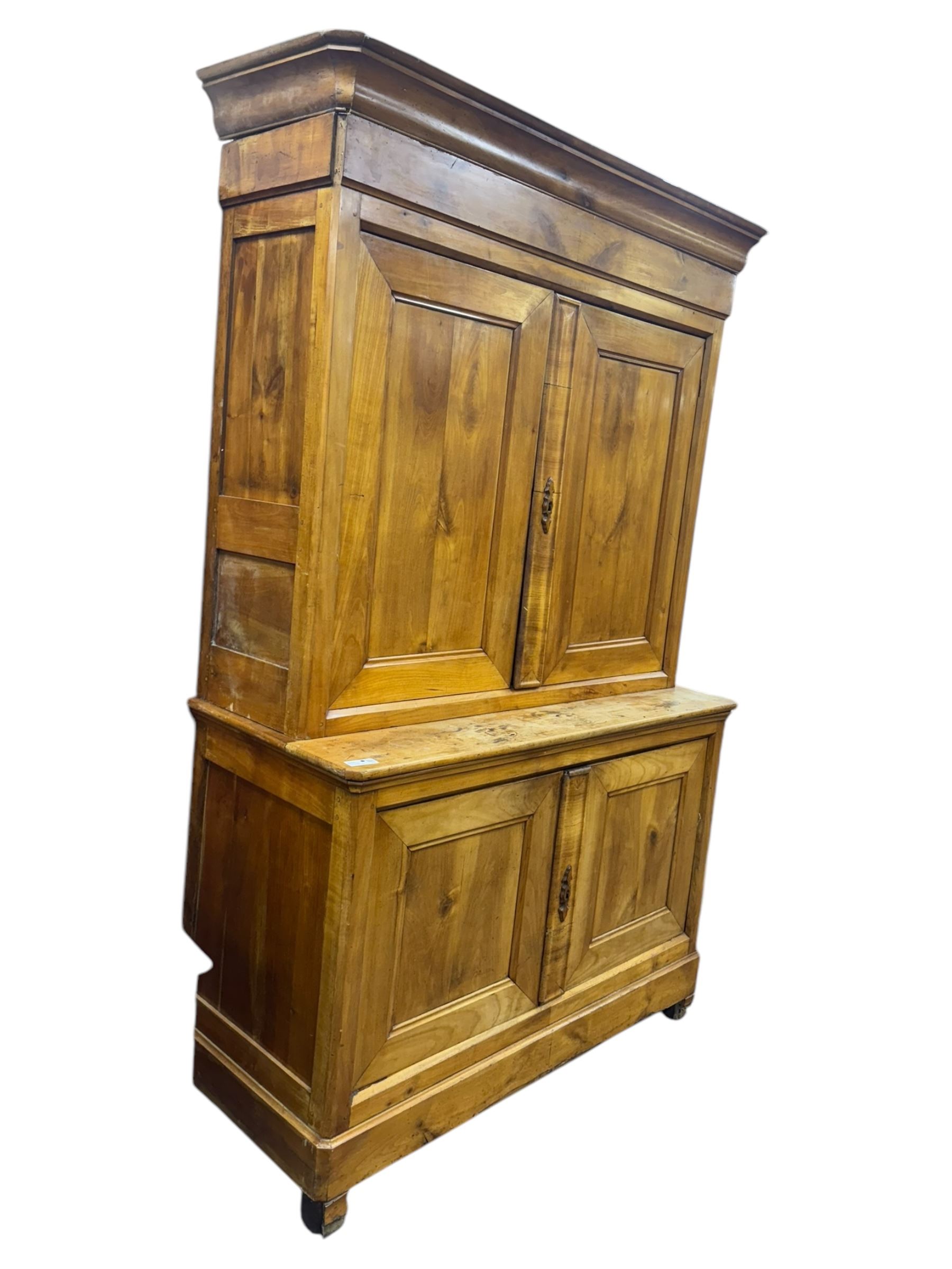 19th century French walnut dresser, the moulded cornice over two-panelled cupboard doors, enclosing two shelves and one small
drawer, on a base of two further cupboards
