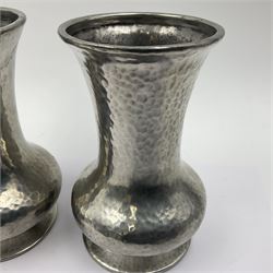 Pair of Liberty & Co Tudric pewter vases, each of bellied form with hammered finish, upon a circular spreading foot, impressed beneath 0987, H12cm