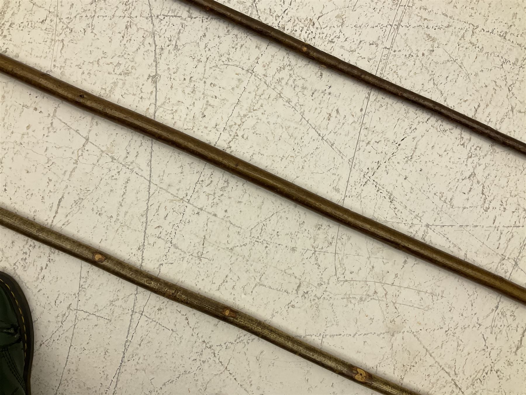 Two smooth polished ram horn handled Shepherd's crooks and a further similar example, together with various shooting sticks, walking sticks and canes, housed in a volcanic lava glaze West German style vase