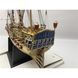 Wooden kit built model of HMS Neptune, 1:90 scale, with detailed rigging to three masts and a row of cannons to either side, upon ebonised wooden base, including stand H71cm