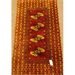  Persian design pink ground rug decorated with Guls, 120cm x 68cm  