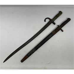 WWI Remington Pattern 1913 bayonet, the 43cm fullered blade with various marks to the ricasso including date code 11 16; in leather covered scabbard with various stamps including JWB 17 L58cm overall; and a French Model 1866 sabre bayonet (no scabbard)