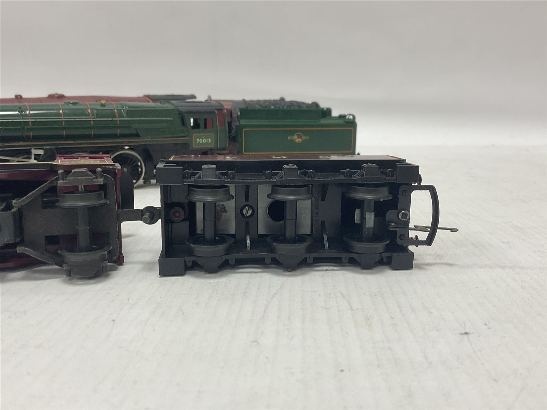 Hornby ‘00’ gauge - four steam locomotives comprising Britannia Class ‘Britannia’ 4-6-2 no.70000 in BR green; Britannia Class ‘Oliver Cromwell’ 4-6-2 no.70013 in BR green; Princess Class 4-6-2 no.6201 in LMS crimson; Coronation Class ‘Duchess of Sutherland’ 4-6-2 no.6233 in LMS crimson; one further tender (5) 