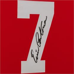 Signed Eric Cantona shirt, framed within a montage of iconic photographs from his Manchester United career, the shirt signed in black marker to the number, with certificate of authenticity from Fisher Promotions, frame H83cm
