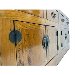20th century Chinese elm sideboard, fitted with four drawers and four cupboards