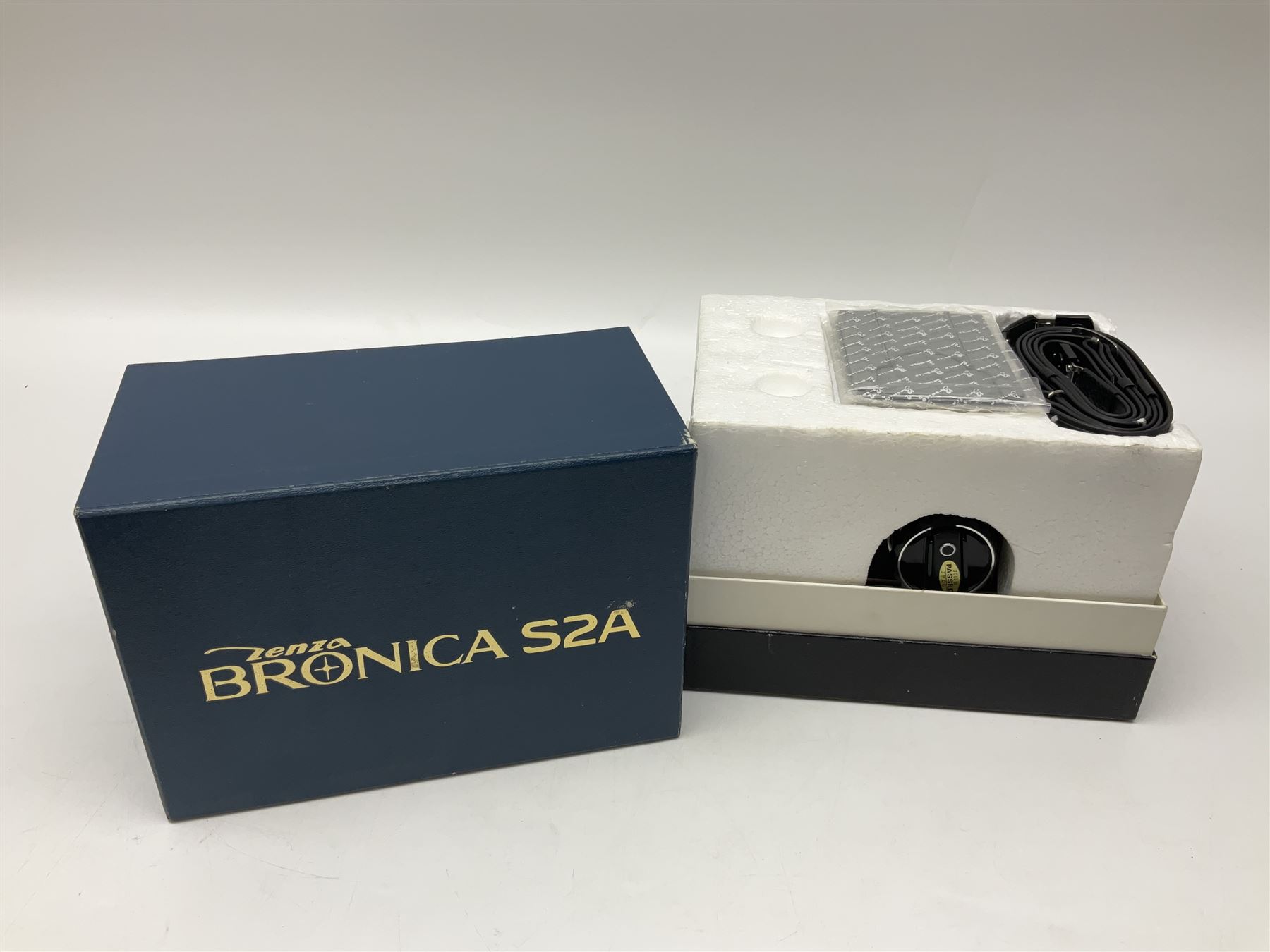 Bronica S2a, type 2 camera body, Serial no. CB152124, with 'Nikon NIKKOR-P 1:2.8 f=75mm' lens, serial no. 190143, in original box 