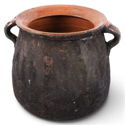 Spanish twin handled cooking pot, blackened to the outside, together with two bowls with slipware glaze, pot H22cm 