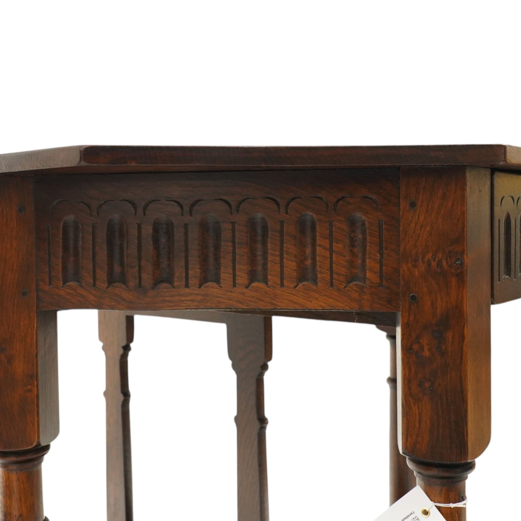 Gothic Revival oak fold-over console table, of octagonal form when unfolded, carved frieze with full length undertier 