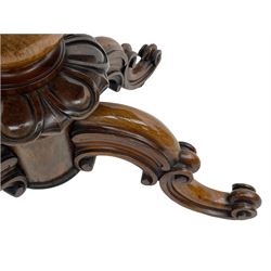 Victorian figured rosewood card table, fold-over swivel top with circular baize lining, moulded frieze with stylised flower head carving to corners, turned column with egg and dart decoration, on quadruple splayed c-scroll carved supports, with brass castors