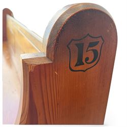 Early 20th century stained pine ecclesiastical church pew, the shaped end supports flanking slatted and panelled back, with black stencilled number '15' to the side