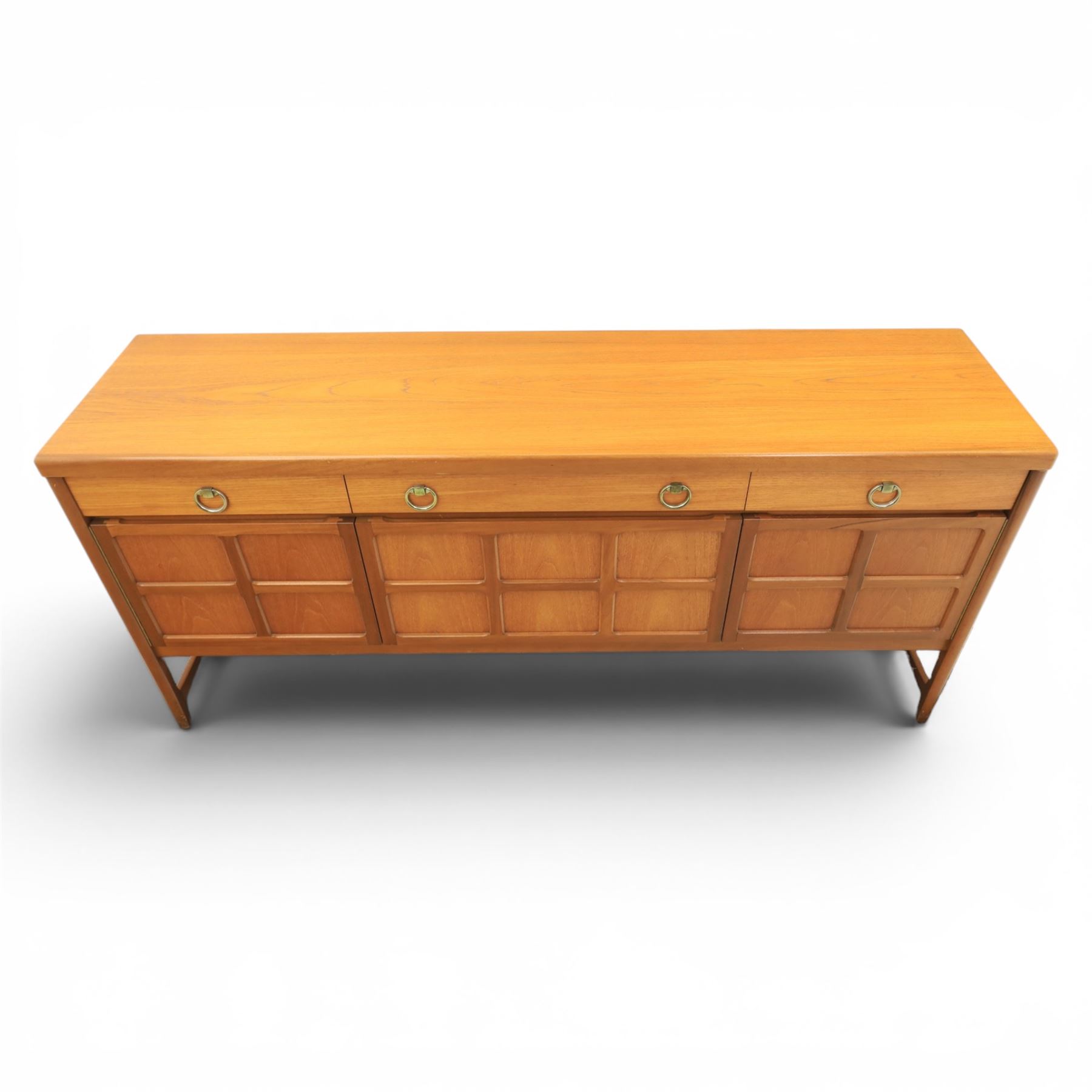Nathan - 'Squares' mid 20th century teak sideboard, fitted with three drawers with brass ring handles, above a central fall front cabinet, flanked by two cupboard doors, raised on square tapering supports