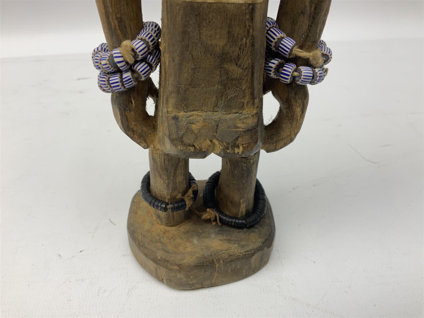 Early 20th century West African Yoruba family wooden figure of Orisha Oko, the god of farming/agriculture, carved from the solid, bears manuscript label of provenance verso H26.5cm