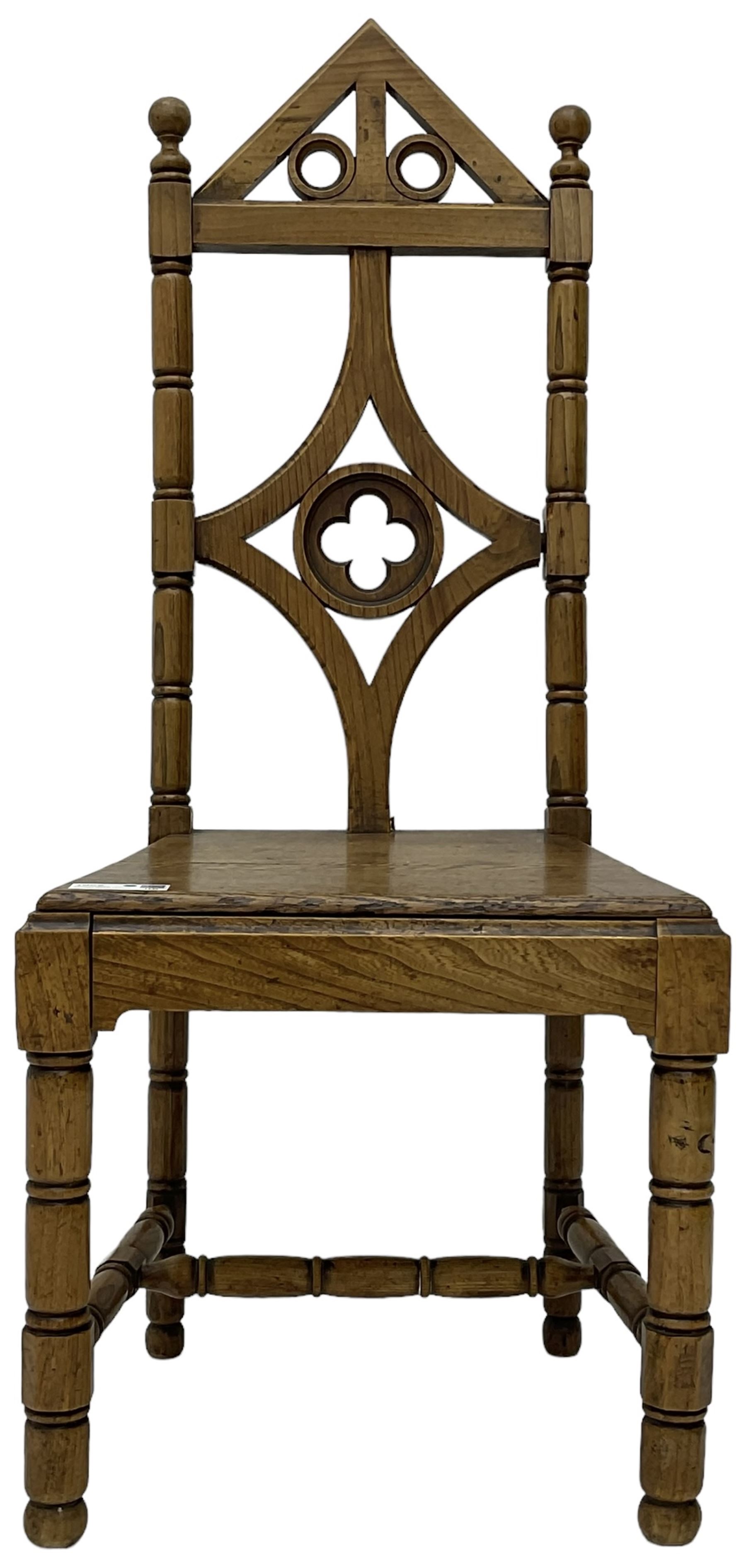 19th century Gothic elm chair, pointed cresting rail over shaped back with central quatrefoil roundel, on turned supports united by turned H-stretchers 
