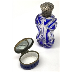 Late 19th century silver mounted glass scent bottle, the blue flash cut waisted body with foliate embossed hinged cover, L9.5cm, together with Georgian Bilston enamel oval patch box, the cover decorated with a dove stood upon an urn, beneath a banner detailed 'Love the Giver', L4cm