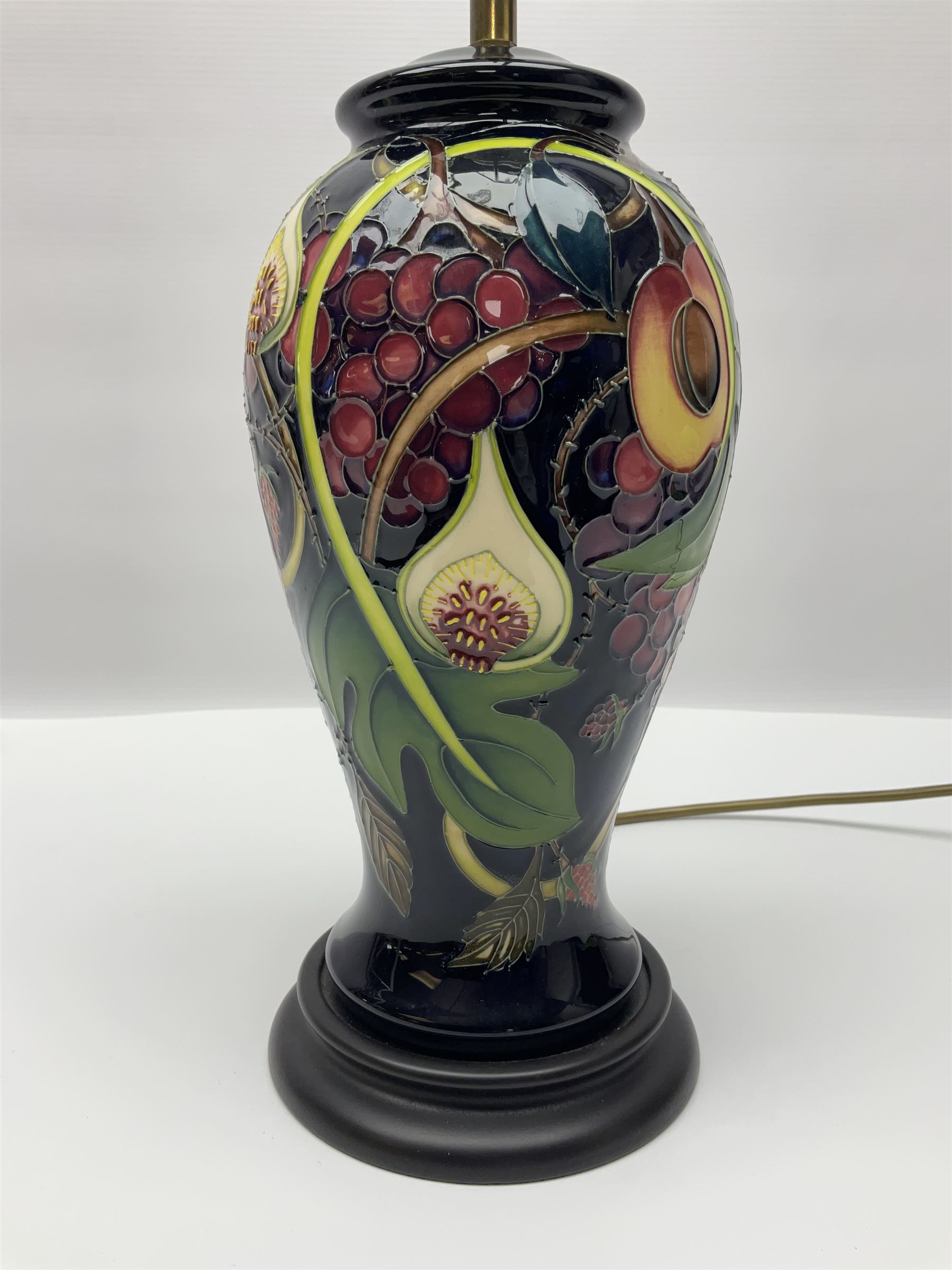 Moorcroft table lamp of baluster form, decorated in the Queens Choice pattern by Emma Bossons, H49cm