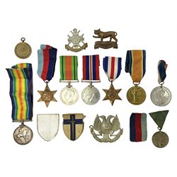 WW1 pair of medals awarded to 151761 Gnr. S. Loten R.A. with ribbons; four WW2 medals with ribbons; and small quantity of cap badges, medallions etc