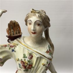 18th century Derby figure of Diana the huntress, circa 1760, modelled reaching for an arrow from quiver across her back, with recumbent hound at her feet, upon a scrolled base with bocage detail, H27.5cm