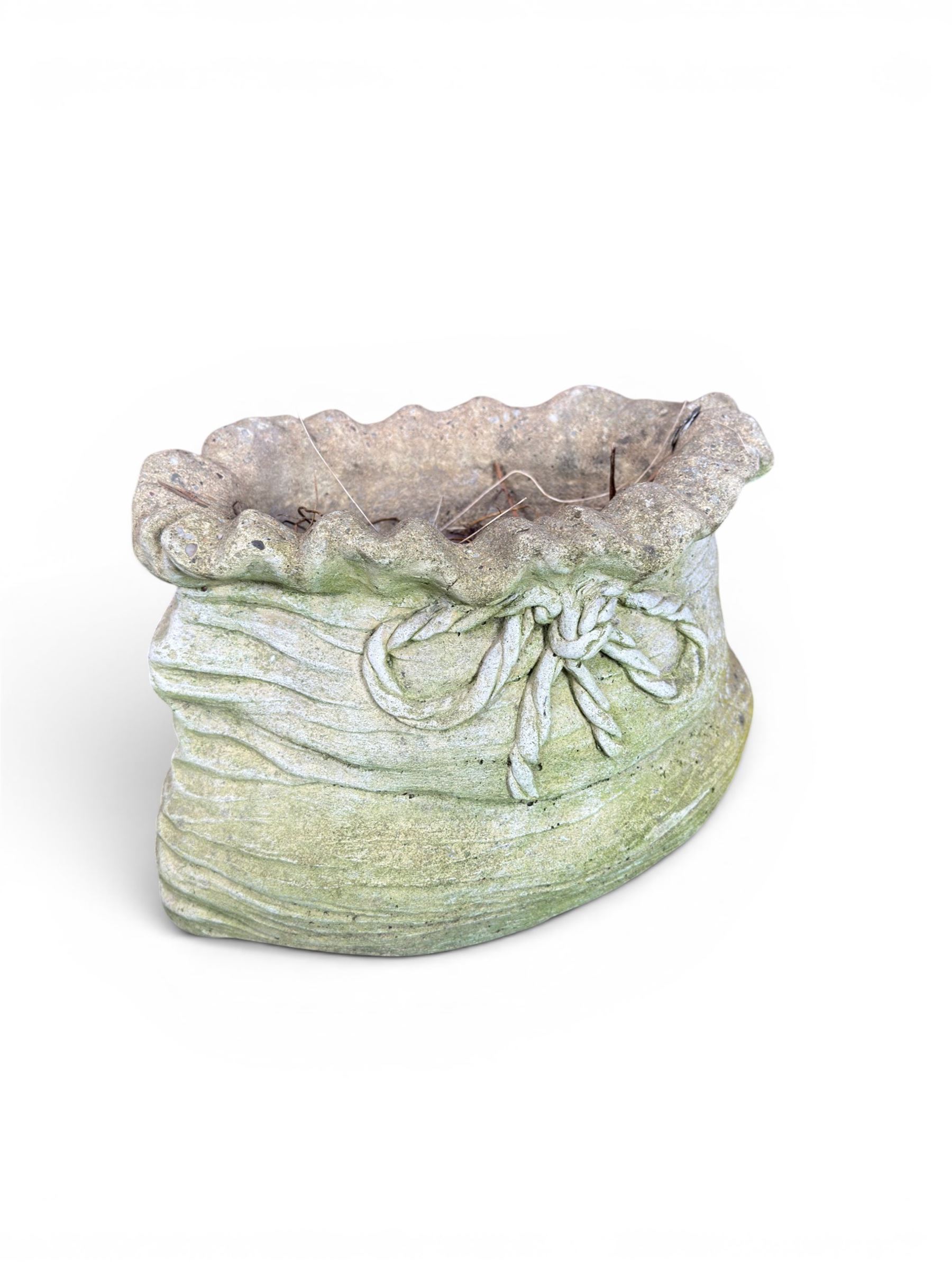 Four cast stone garden planters in the form of ribbon tied planting sacks