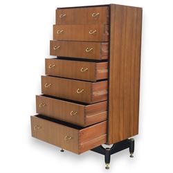 G Plan - 'Librenza' tola wood chest of seven drawers, gold coloured metal pulls on an ebonised based with gold coloured feet