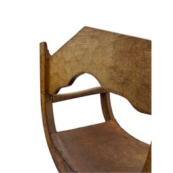 'Gnomeman' oak curved x-framed throne chair, sloped arched cresting rail carved with arcade, studded slung leather seat, the supports joined by sledge feet, rear upright carved with gnome signature, by Thomas Whittaker of Littlebeck