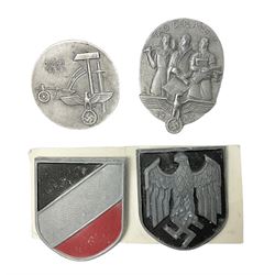 Two WW2 German 'tinnie' badges - Labour Day 1935 by Overhoff & Cie Ludenscheid & Labour Day 1936 by Ziemer & Sohne Oberstein/Nahe; together with pair of Afrika Korps tropical (pith) helmet metal decals (4)