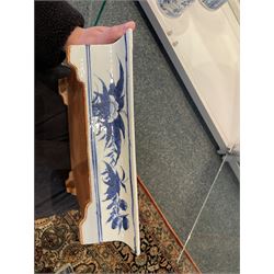 Chinese blue and white planter and stand, each of square slightly tapering and flared form, the planter decorated with two dragons and blossoming peonies, between stylised borders, the stand decorated with flower heads and vines, planter H30cm W29cm, stand H7cm D28.5cm