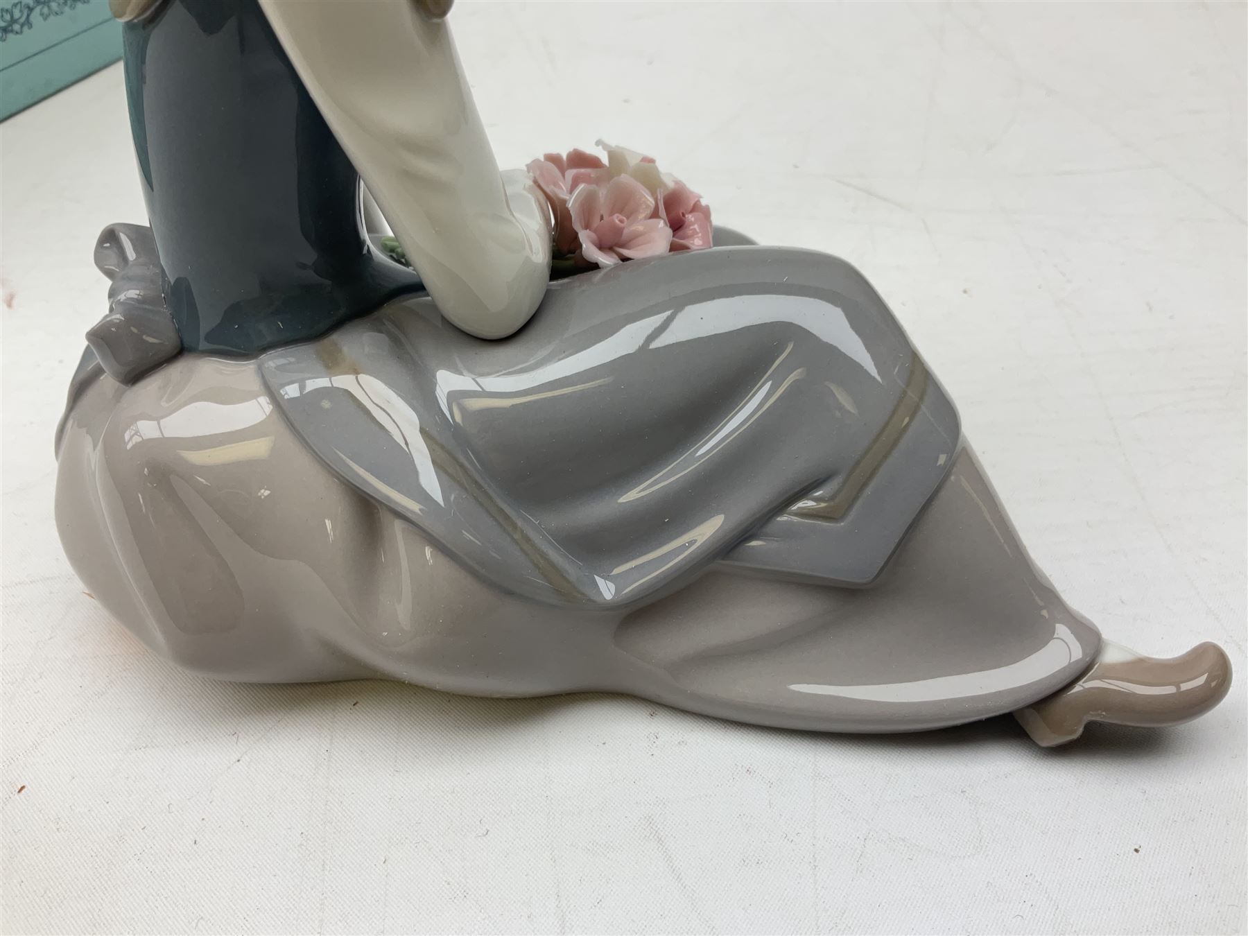 Three Lladro figures, comprising Pondering, no 5173, Nostalgia, no 5071 and Nature's Bounty, no 1417, all with original boxes, largest example H27cm