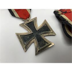 WWII German Iron Cross 2nd Class, the suspension ring stamped 128 for S. Jablonski G.m.b.H. Posen; with ribbon; together with an embroidered cloth eagle badge and quantity of German medal ribbons.