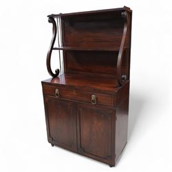 Regency mahogany lyre chiffonier, tall two-tier raised back with serpentine supports and brass pillars, the drawer fitted with sliding writing surface with divisions and pen and ink stands, seven internal drawers with lion mask handles enclosed by panelled doors, inlaid with ebony stringing
