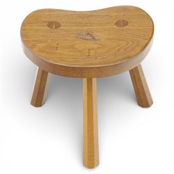 Eagleman - small oak calf stool, raised on three octagonal supports with signature Eagle motif to the seat from the workshop of Albert Jeffray, Sessay