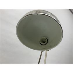 Adjustable chrome  desk lamp upon a circular base 