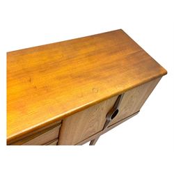 Stonehill - mid-20th century teak sideboard, three central drawers flanked by concertina cupboard doors, on tapering supports
