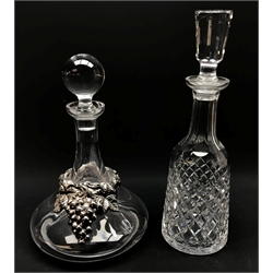 Modern glass decanter with silver grape moulded mount by Vestita D'Argento Un'idea, Bauri, stamped 925 and a Waterford Alana cut decanter (2)  