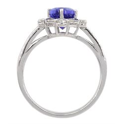 18ct white gold tanzanite and diamond cluster ring, oval tanzanite, with baguette and round brilliant cut diamond surround and baguette cut diamond shoulders, stamped 750, tanzanite approx 1.80 carat, total diamond weight approx 0.55 carat
