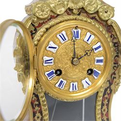Louis XV-style gilt-bronze mounted turtleshell boulle mantel clock, the case of typical waisted form, gilt bronze foliate scroll and rocaille mounts, raised on scroll feet. Eight-day Paris movement signed “Rollin à Paris”, with outside count-wheel striking half-hourly on a single bell, the going train with anchor escapement. The circular foliate gilt bronze dial with enamelled Roman hour numerals and twin winding apertures, fitted with pierced blue steel hands and bevelled glass cover, with pendulum and key, circa 1860