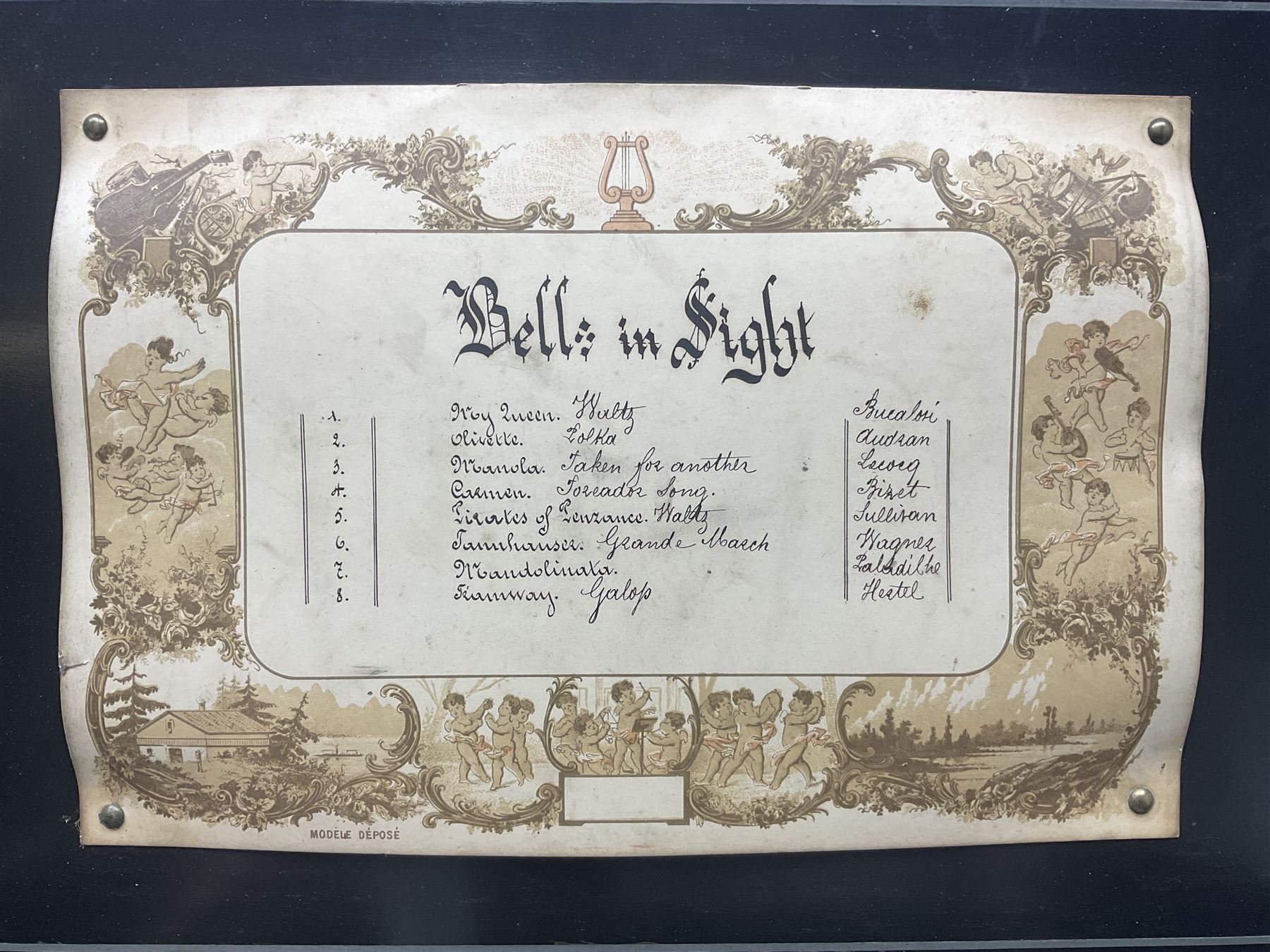 Large late 19th century Swiss bells-in-sight musical box with 27.5cm cylinder playing eight airs on a 27cm two-piece comb with seventy-seven teeth and six graduated engraved saucer bells with strike/silent facility; in crossbanded rosewood and ebonised case, the front and hinged lid inlaid with musical trophies, opening to reveal a song card under the lid and hinged glazed cover to the movement; serial no.7539 L53cm