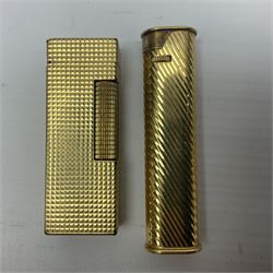 Dunhill gold plated dress lighter, in original fitted case with paperwork, together with a Dunhill rolagas lighter