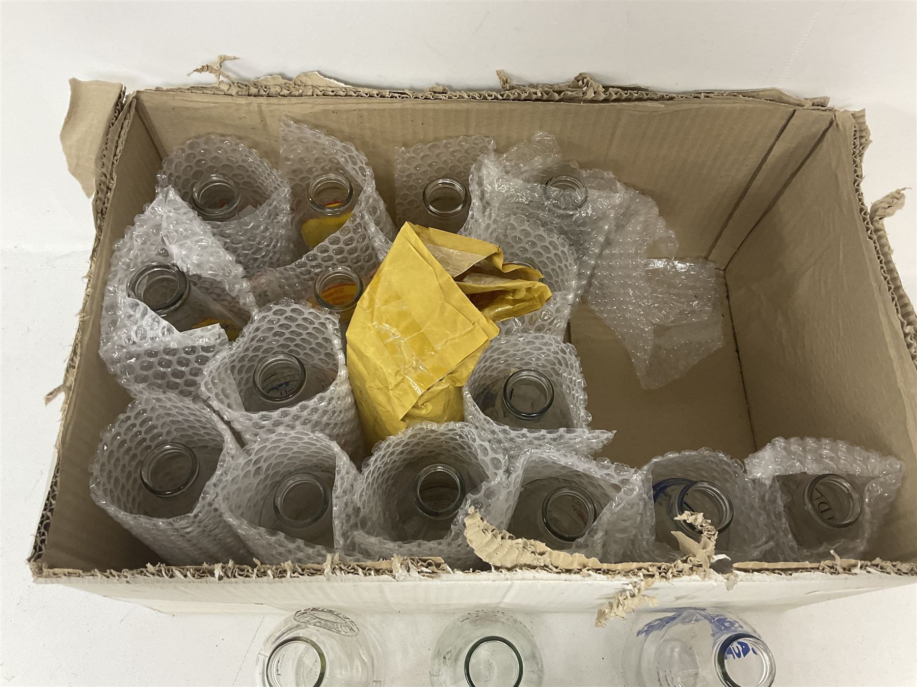 Twenty one vintage advertising milk bottles