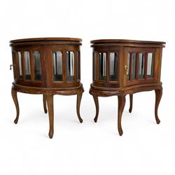 Near pair of early 20th century French walnut bedside display cabinets, each with glazed s...