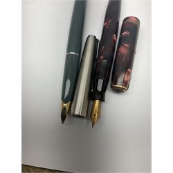 Collection of fountain and ball point Parker pens, to include gold nib examples stamped 14K with cases, other cased and loose pens and a cased set of drawing instruments