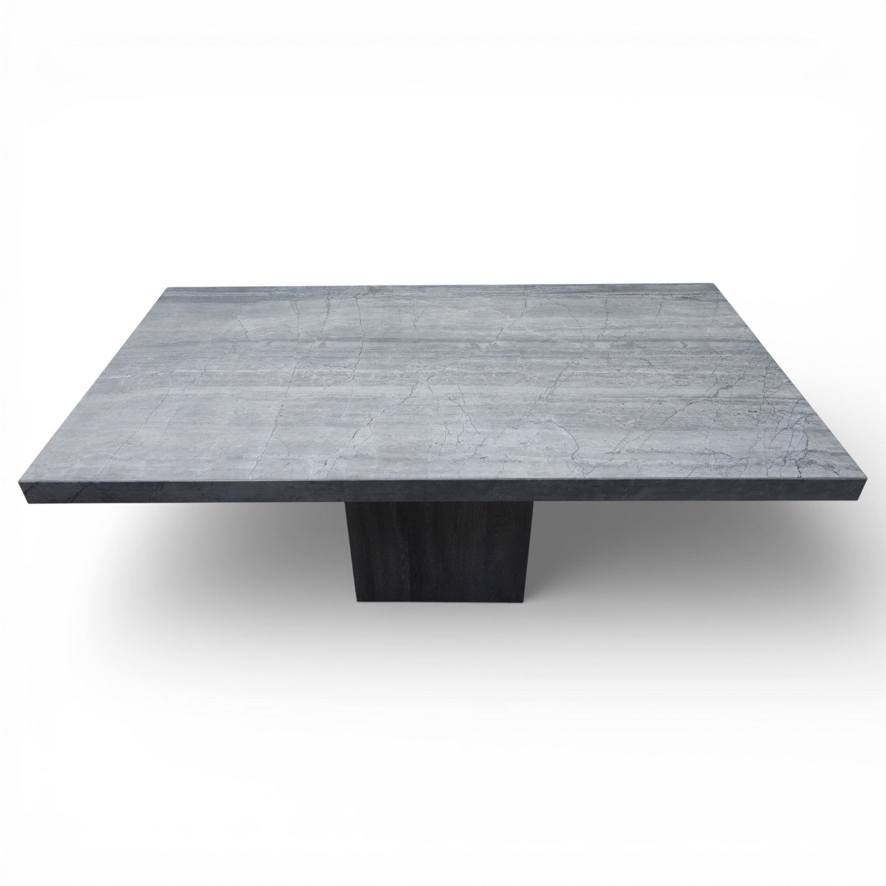 Modern composite marble effect dining table, rectangular top with simulated veining supported on a block pedestal base, accompanied by six matching dining chairs with padded seats and backs in grey upholstery on slim metal legs