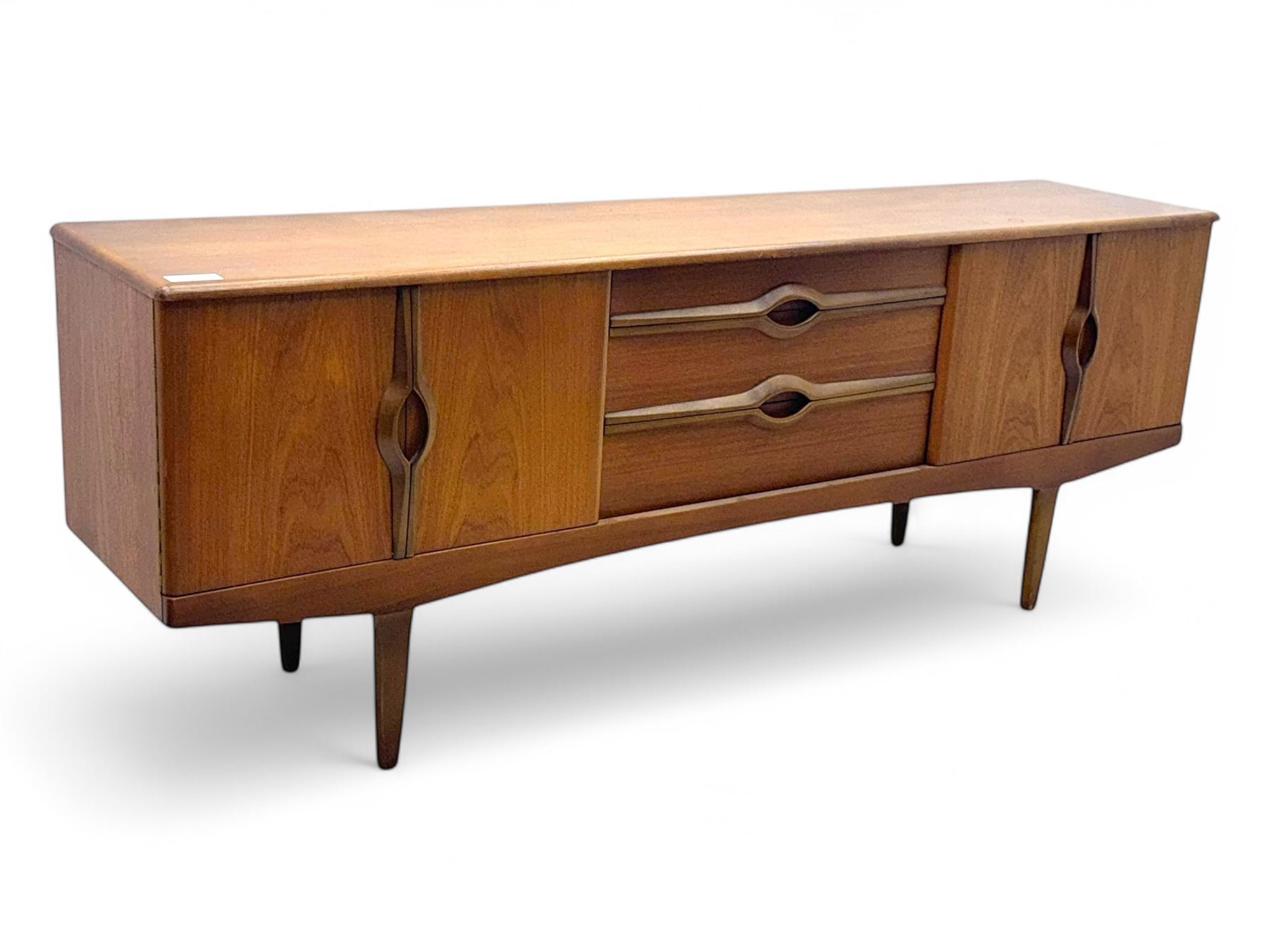 Stonehill - mid-20th century teak sideboard, three central drawers flanked by concertina cupboard doors, on tapering supports