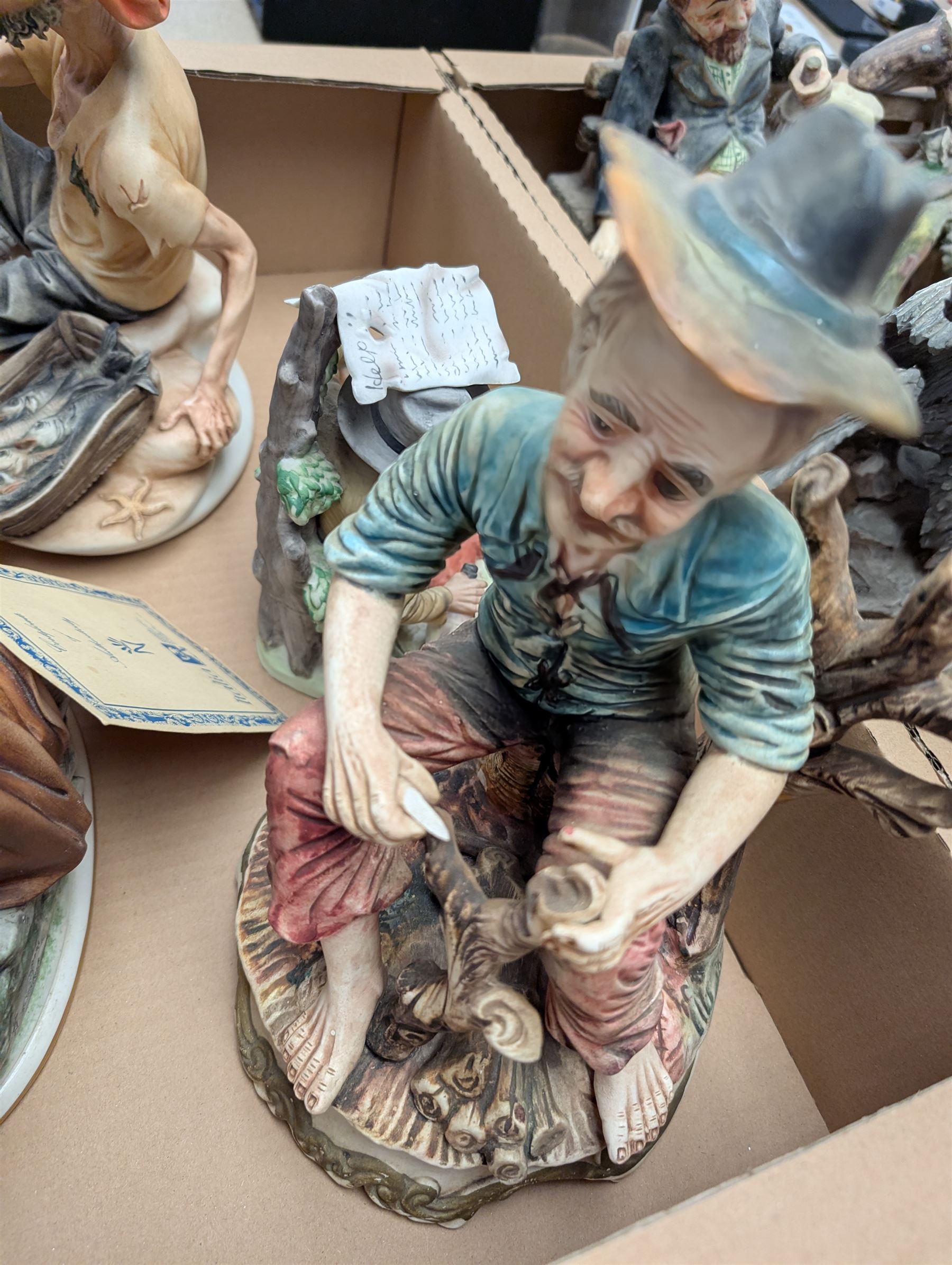 Six Capodimonte and similar figures, including Fisherman, Eagle and tramp examples, tallest 