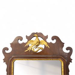 George III mahogany side table, the rectangular moulded top above a single frieze drawer fitted with brass swan neck handles, above a shaped serpentine apron raised upon square section legs, W86 D42 H75cm, together with a George III fretwork mirror, the rectangular plate within a gilt slip surmounted by a pierced crest with inset carved Ho-Ho bird, with shaped apron with gilt shell motif, H84cm W45cm